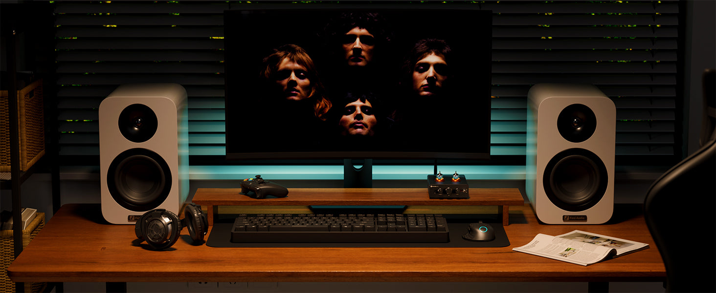 desktop HiFi audio setup with Fosi Audio headphone amp and speakers